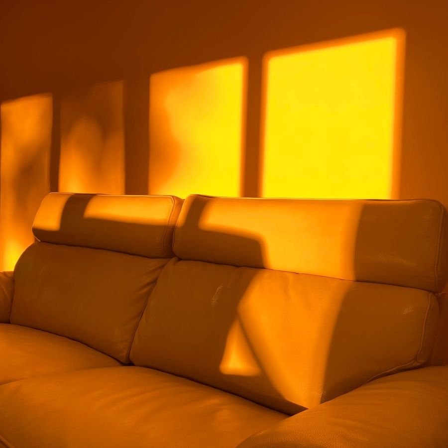 Square ad: a sofa washed in warm evening light