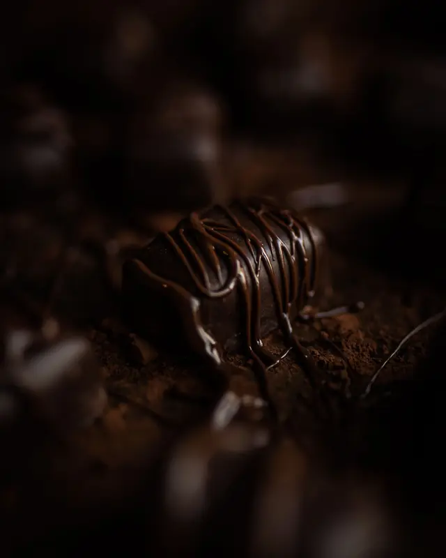 A chocolate bar drizzled with chocolate in shadow
